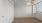 a room with a window and ceiling fan